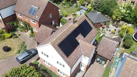 A UK home photographed from above with a full roof array fitted